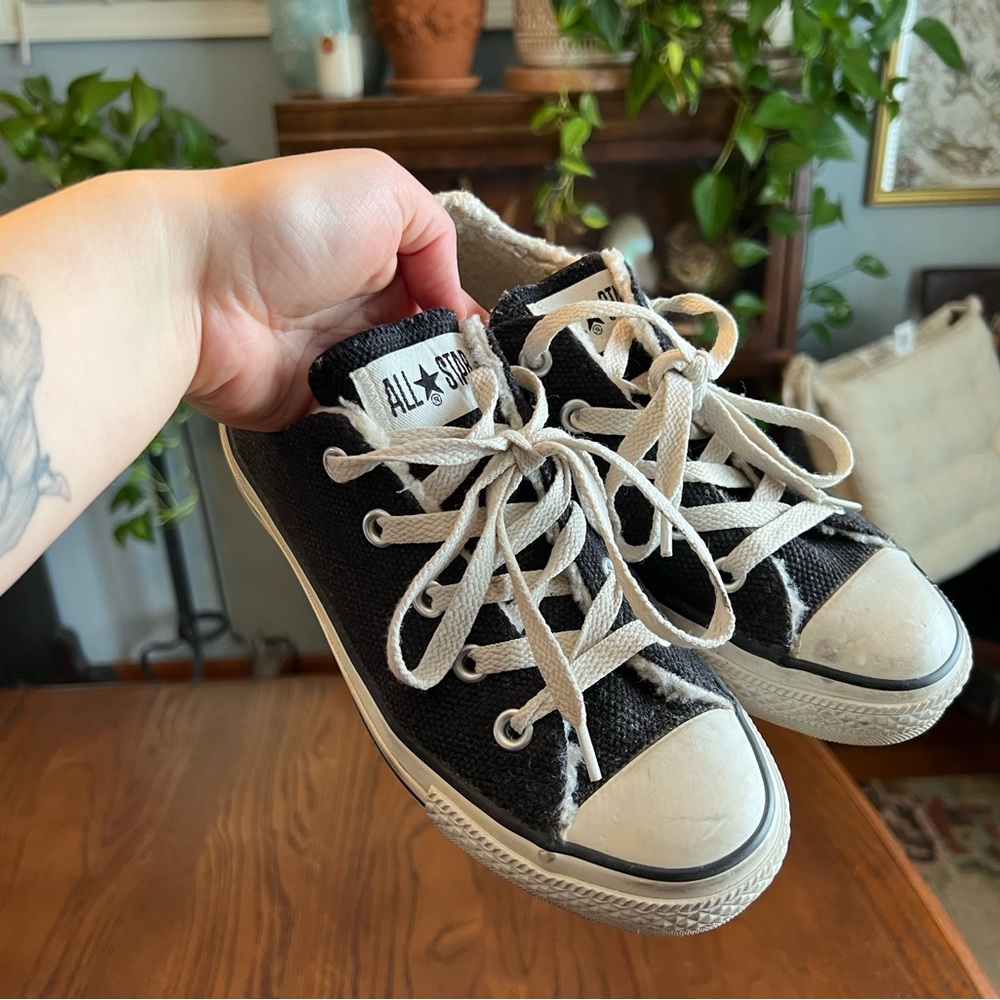 black sherpa-lined low top converse